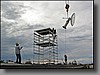 One of the goals of the housekeeping trip was to setup and test the weather radar.  Here the dish and pedestal are being lifted onto the roof.